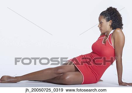 Young woman posing for the camera View Large Photo Image Stock Photo - Young woman posing for the camera. Fotosearch