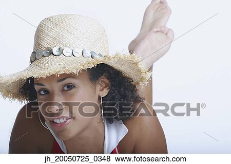 Young woman posing for the camera View Large Photo Image Stock Photo - Young woman posing for the camera. Fotosearch