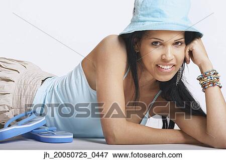 Young woman posing for the camera View Large Photo Image Stock Photo - Young woman posing for the camera. Fotosearch