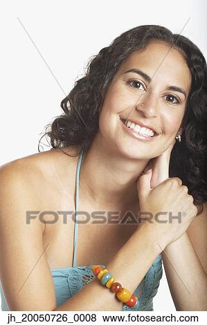 Young woman posing for the camera View Large Photo Image Stock Photo - Young woman posing for the camera. Fotosearch