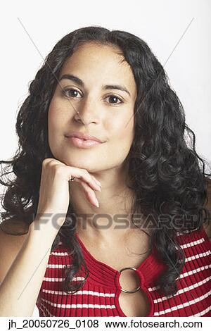 Young woman posing for the camera View Large Photo Image Stock Photo - Young woman posing for the camera. Fotosearch