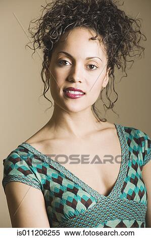 Young woman posing for the camera View Large Photo Image Stock Photography - Young woman posing for the camera. Fotosearch