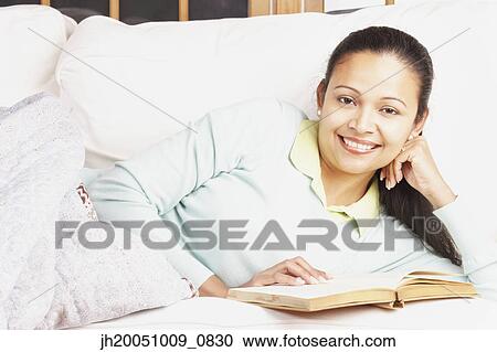 Young woman reading View Large Photo Image Stock Image - Young woman reading. Fotosearch
