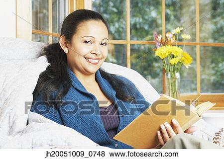 Young woman reading View Large Photo Image Stock Photo - Young woman reading. Fotosearch