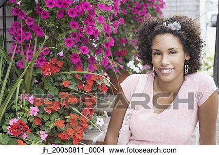 Young woman smiling for the camera View Large Photo Image Picture - Young woman smiling for the camera. Fotosearch