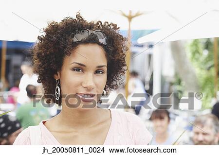 Young woman smiling for the camera View Large Photo Image Picture - Young woman smiling for the camera. Fotosearch