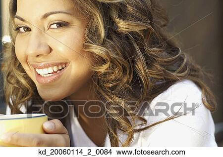 Young woman smiling for the camera View Large Photo Image Picture - Young woman smiling for the camera. Fotosearch