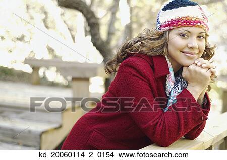 Picture - Young woman smiling for the camera. Fotosearch