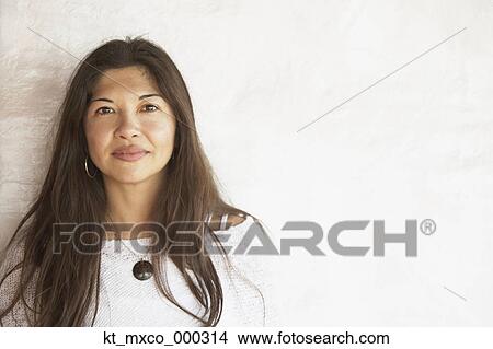 Young woman smiling for the camera View Large Photo Image Picture - Young woman smiling for the camera. Fotosearch