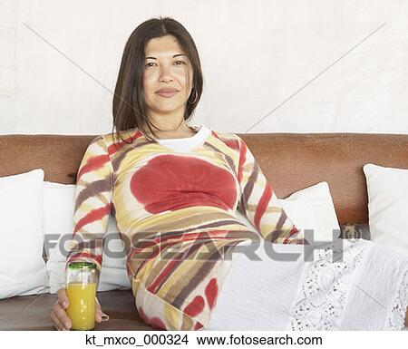 Young woman smiling for the camera View Large Photo Image Picture - Young woman smiling for the camera. Fotosearch