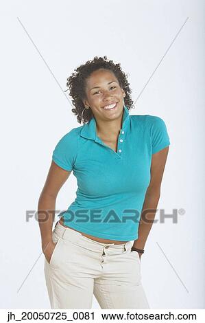 Young woman smiling for the camera View Large Photo Image Stock Image - Young woman smiling for the camera. Fotosearch