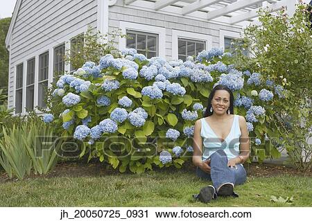 Young woman smiling for the camera View Large Photo Image Stock Image - Young woman smiling for the camera. Fotosearch