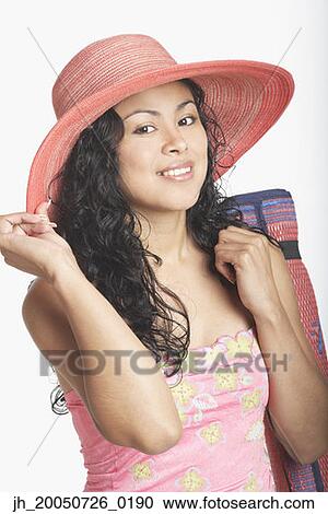 Young woman smiling for the camera View Large Photo Image Stock Image - Young woman smiling for the camera. Fotosearch