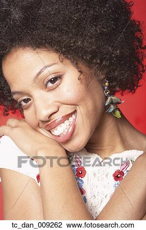 Young woman smiling for the camera View Large Photo Image Stock Image - Young woman smiling for the camera. Fotosearch