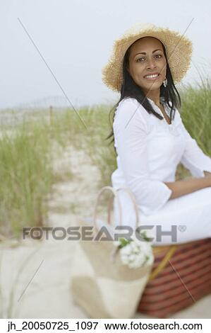 Young woman smiling for the camera View Large Photo Image Stock Photo - Young woman smiling for the camera. Fotosearch