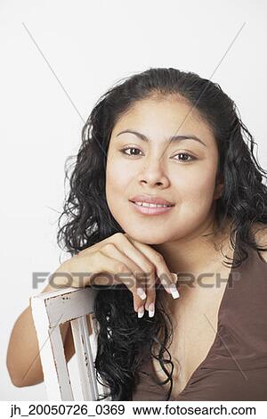Young woman smiling for the camera View Large Photo Image Stock Photo - Young woman smiling for the camera. Fotosearch