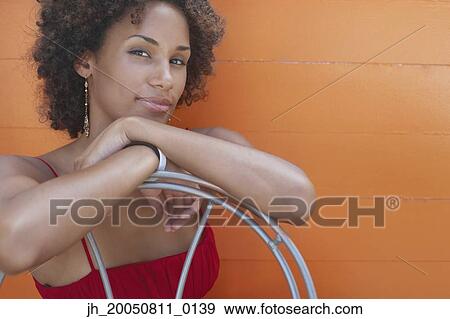 Stock Photo - Young woman smiling for the camera. Fotosearch