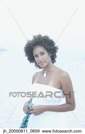 Young woman smiling for the camera View Large Photo Image Stock Photo - Young woman smiling for the camera. Fotosearch