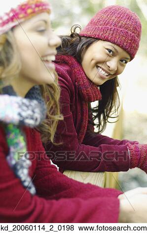 Stock Photo - Young woman smiling for the camera. Fotosearch