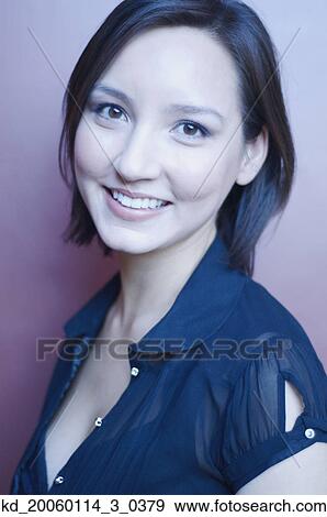 Stock Photo - Young woman smiling for the camera. Fotosearch