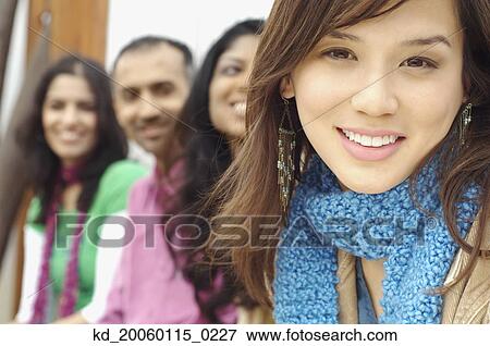 Stock Photo - Young woman smiling for the camera. Fotosearch