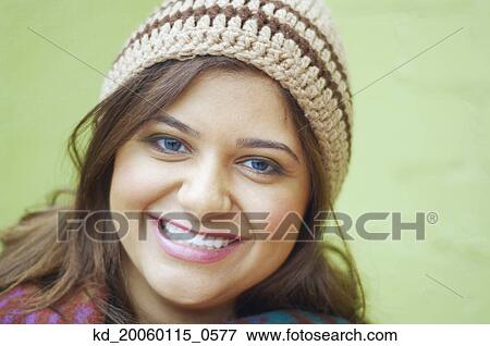 Stock Photo - Young woman smiling for the camera. Fotosearch