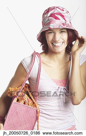 Young woman smiling for the camera View Large Photo Image Stock Photograph - Young woman smiling for the camera. Fotosearch