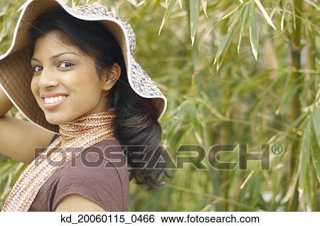 Stock Photograph - Young woman smiling for the camera. Fotosearch