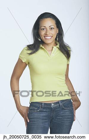 Young woman smiling for the camera View Large Photo Image Stock Photography - Young woman smiling for the camera. Fotosearch