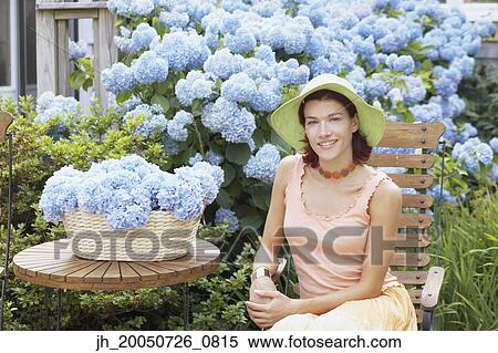 Young woman smiling for the camera View Large Photo Image Stock Photography - Young woman smiling for the camera. Fotosearch