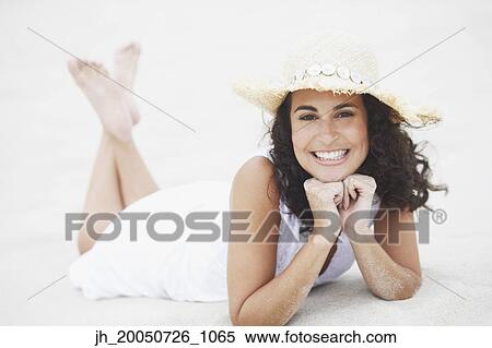 Young woman smiling for the camera View Large Photo Image Stock Photography - Young woman smiling for the camera. Fotosearch