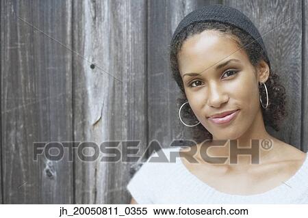 Stock Photography - Young woman smiling for the camera. Fotosearch