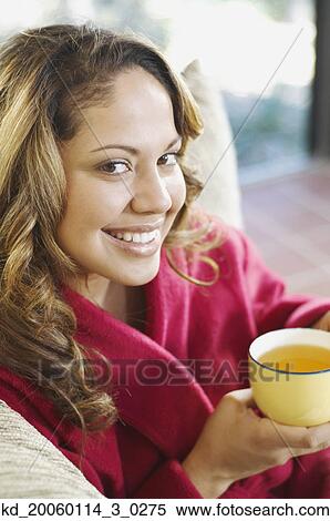 Young woman smiling for the camera View Large Photo Image Stock Photography - Young woman smiling for the camera. Fotosearch