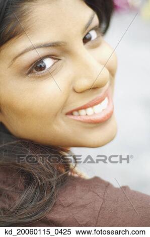 Stock Photography - Young woman smiling for the camera. Fotosearch