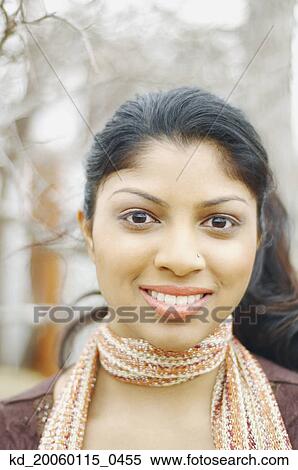 Stock Photography - Young woman smiling for the camera. Fotosearch