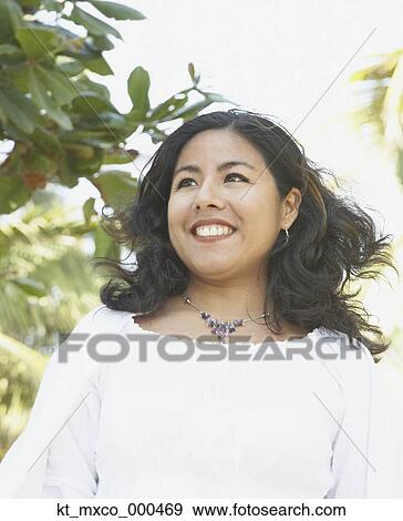 Young woman smiling View Large Photo Image Stock Photo - Young woman smiling. Fotosearch