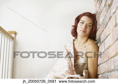 Young woman wrapped up in a blanket View Large Photo Image Stock Image - Young woman wrapped up in a blanket. Fotosearch