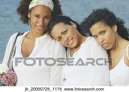 Young women smiling for the camera View Large Photo Image Stock Photography - Young women smiling for the camera. Fotosearch