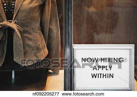 Stock Photo - ÏNow HiringÓ sign in store window. Fotosearch
