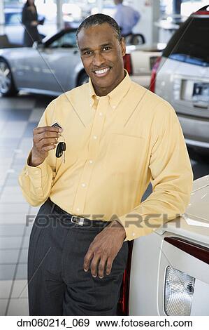 Car salesman smiling View Large Photo Image Stock Photo - Car salesman smiling. Fotosearch