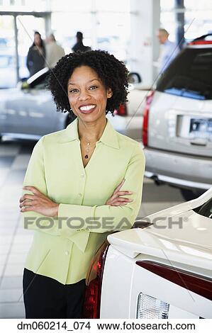 Car saleswoman smiling View Large Photo Image Picture - Car saleswoman smiling. Fotosearch
