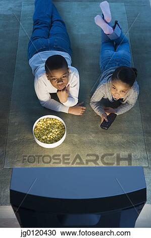 Stock Image - Children watching television. Fotosearch
