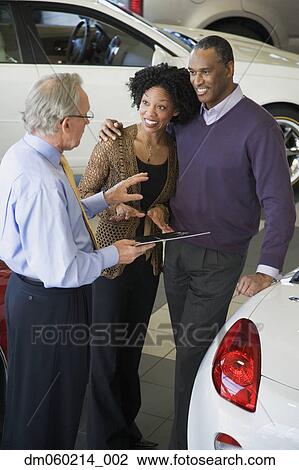 Stock Image - Couple buying a car. Fotosearch