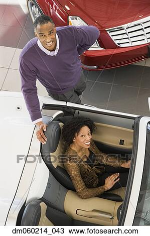 Couple buying a car View Large Photo Image Stock Image - Couple buying a car. Fotosearch