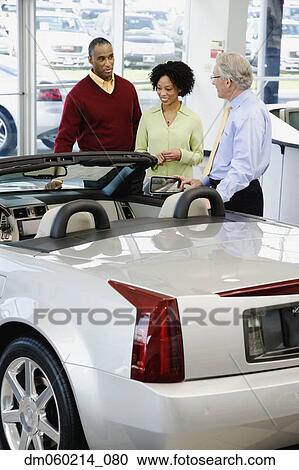 Stock Image - Couple buying a car. Fotosearch