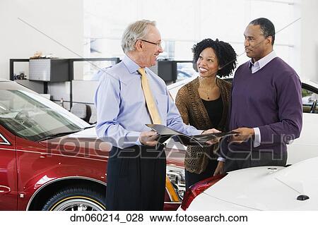 Stock Photo - Couple buying a car. Fotosearch