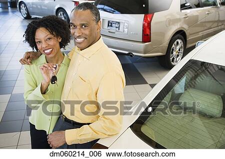Couple buying a car View Large Photo Image Stock Photograph - Couple buying a car. Fotosearch