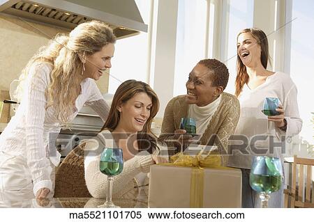 Friends drinking wine together View Large Photo Image Stock Photography - Friends drinking wine together. Fotosearch