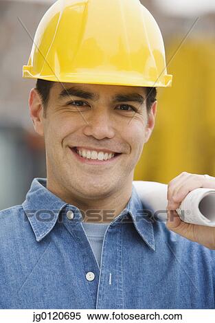 Manual worker holding blueprints View Large Photo Image Stock Photography - Manual worker holding blueprints. Fotosearch
