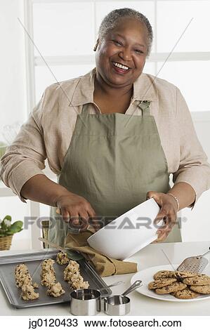 Senior woman making cookies View Large Photo Image Stock Image - Senior woman making cookies. Fotosearch